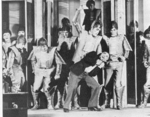 Photo 2: A scene from the science-fiction play R.U.R. (1920). Source: https://upload.wikimedia.org/wikipedia/commons/d/d9/Capek_RUR.jpg