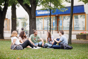 Students sitting at the Campus of the University of Vienna